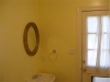 Bright Yellow Paint Overwhelms Bathroom